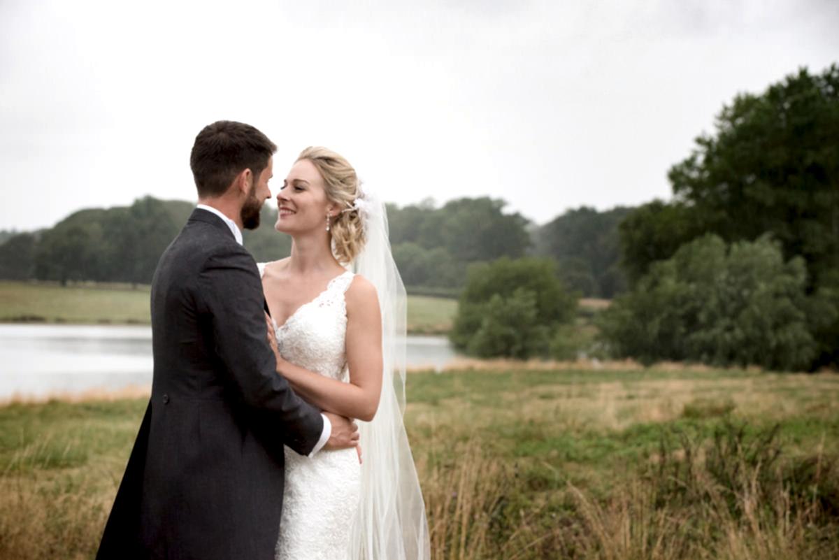 Bride & Groom on the shore of Rutland Water at Barnsdale Hall Hotel