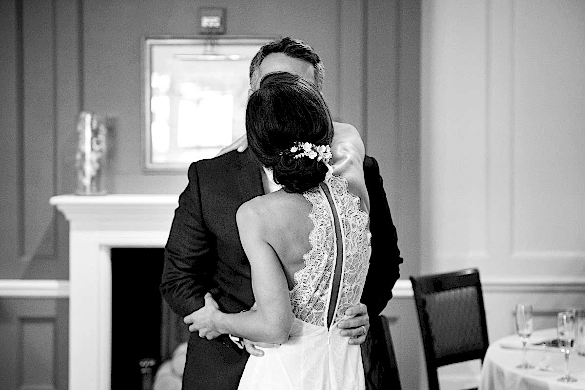 Bride and groom embracing after the speeches