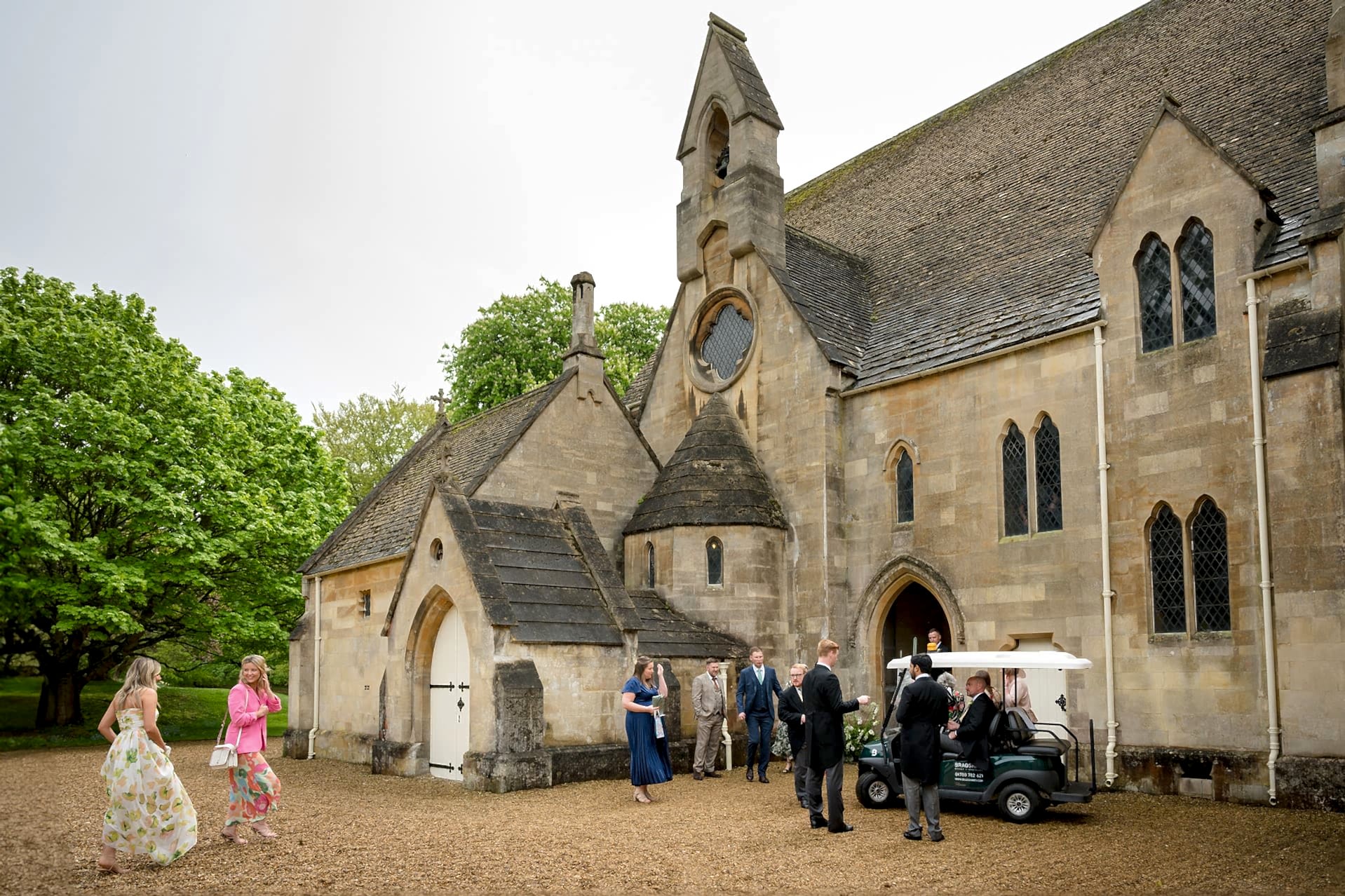 Wedding guests arriving outside Exton Park chapel