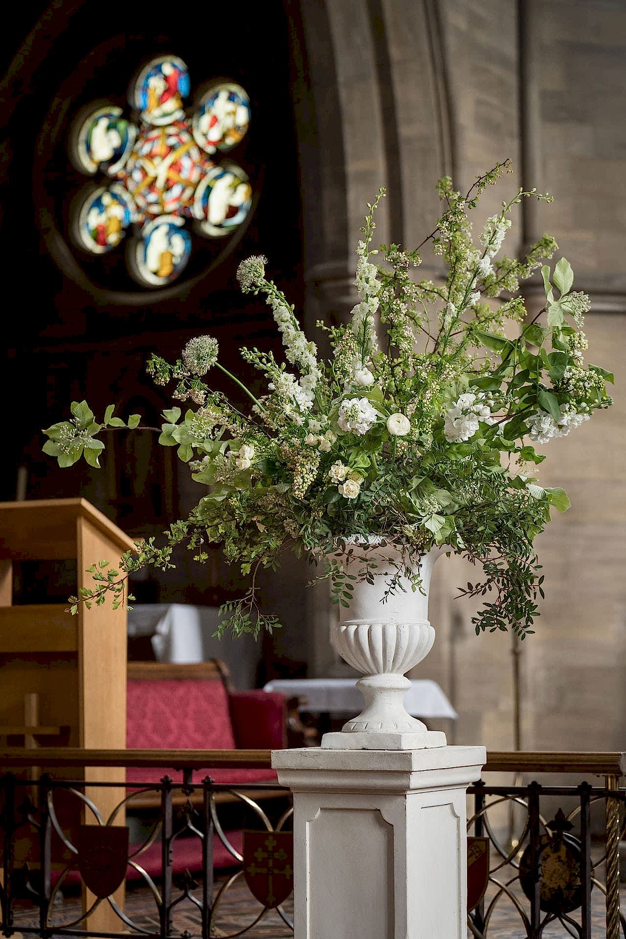 An urn of fresh flowers inside Exton Park chapel