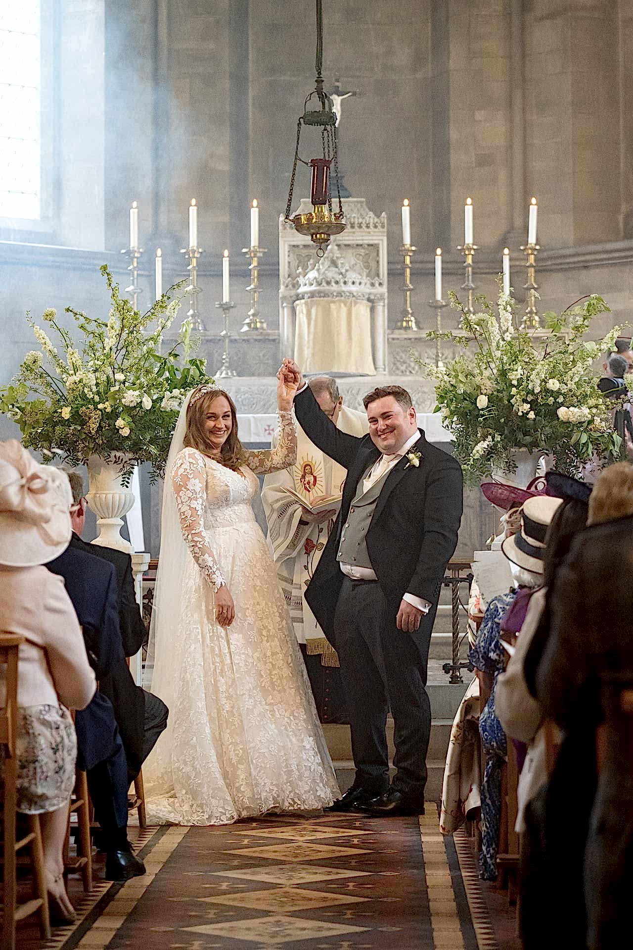 The bride and groom looking elated to be pronounced husband and wife at Exton Park chapel
