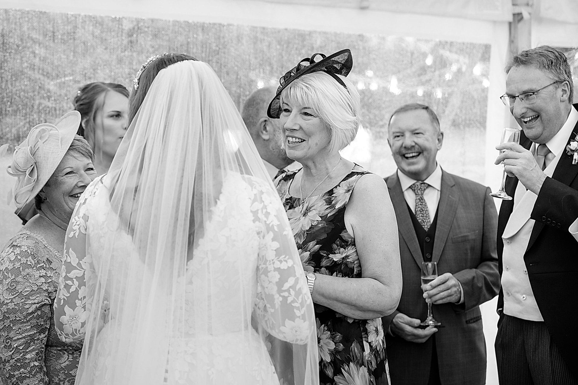 Bride chatting to wedding guests