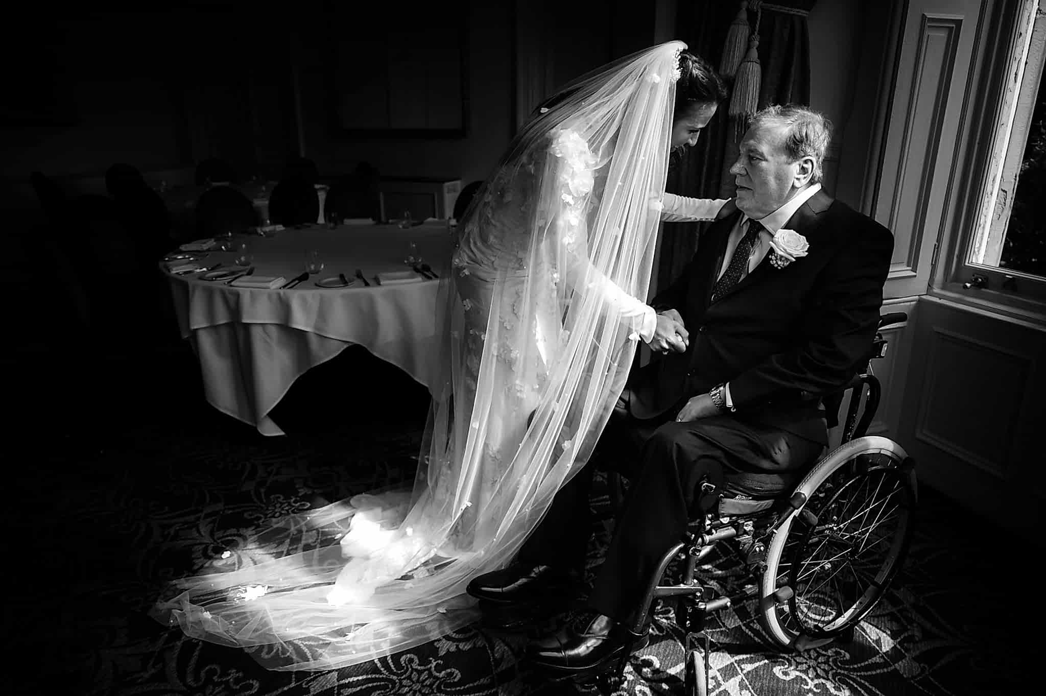The bride's dad seeing the bride in her dress for the first time