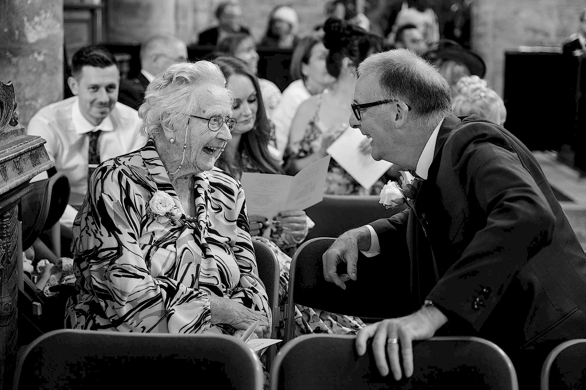 The groom's Granny laughing with a family member