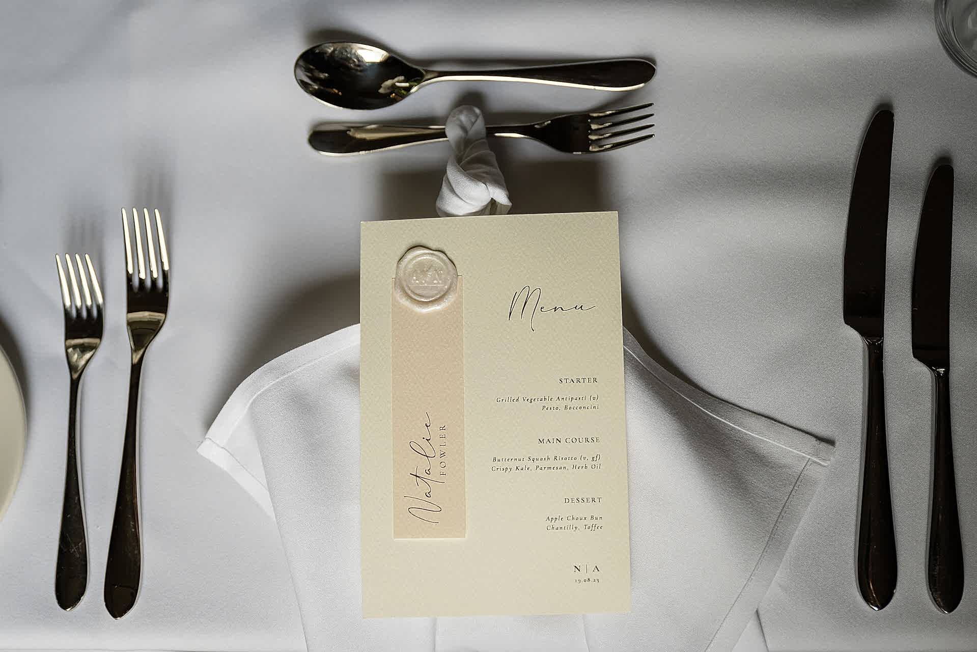 A cream wedding breakfast menu personalised for the bride