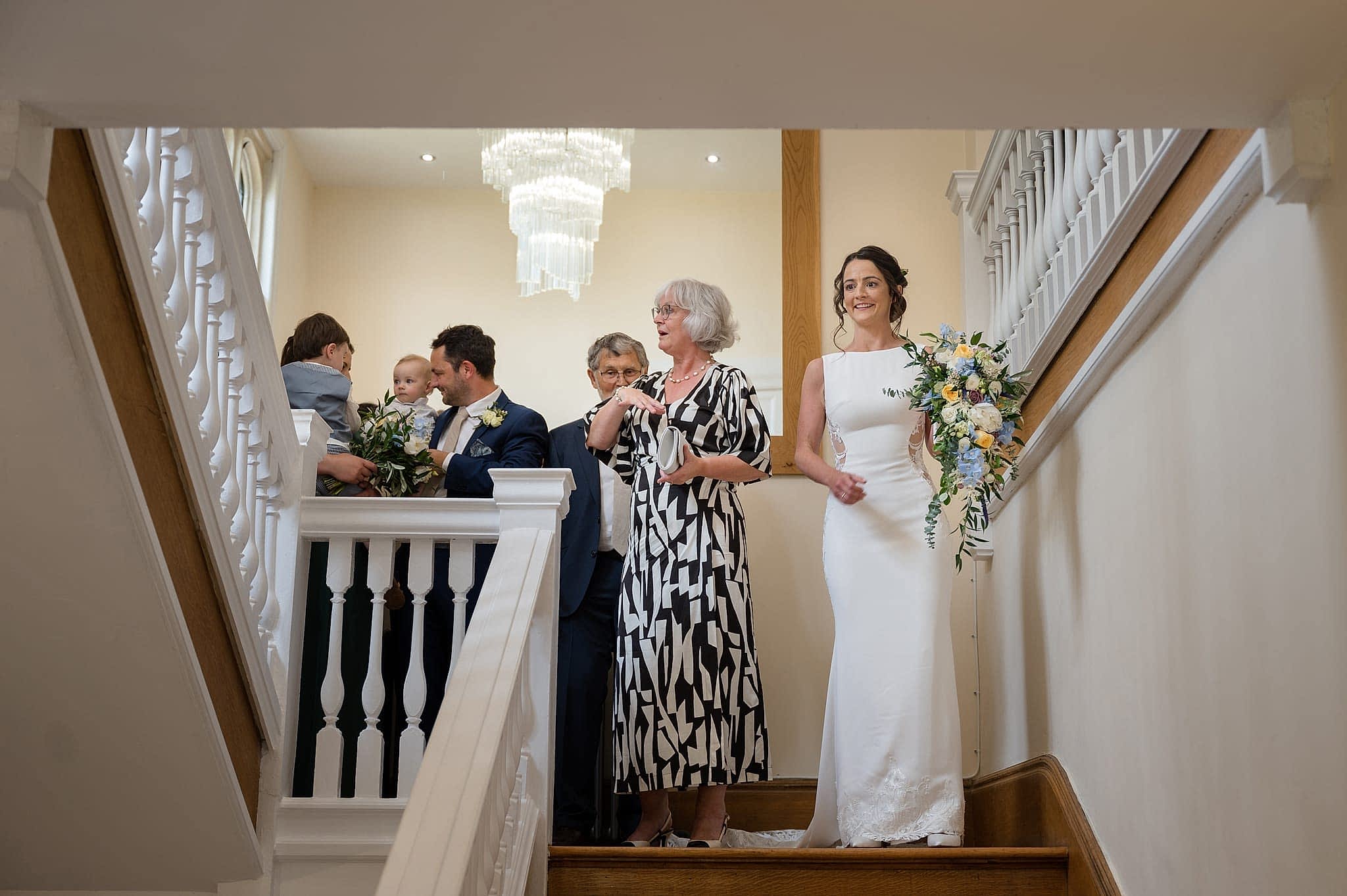 Bride about to walk down the staircase at Notley Abbey