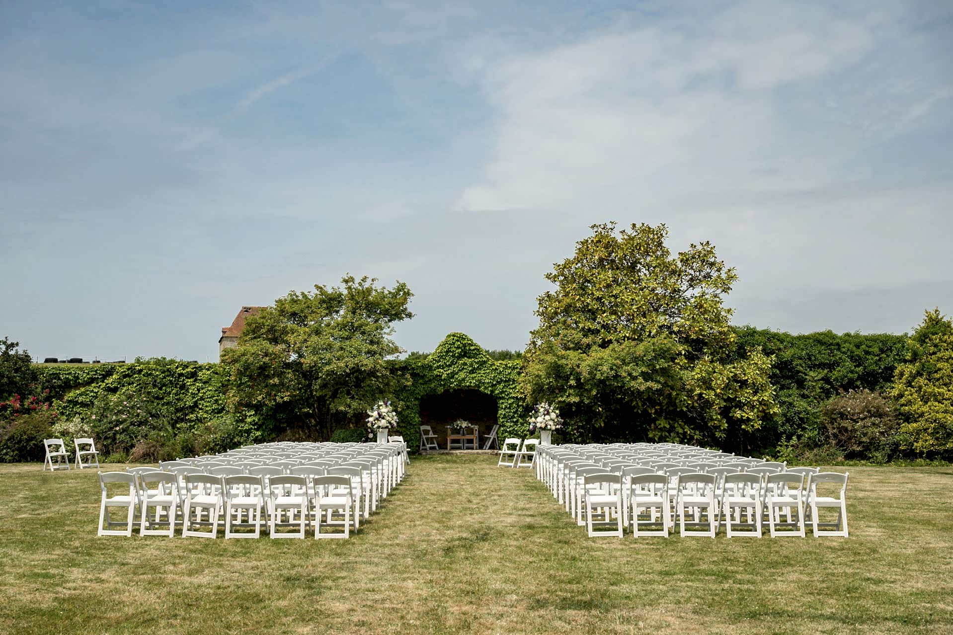 The walled garden at Notley Abbey set up ready for an outdoor wedding ceremony