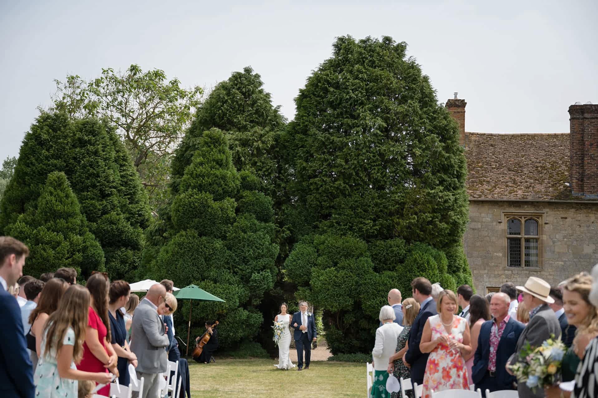 The bride and her dad walking down the aisle at Notley Abbey