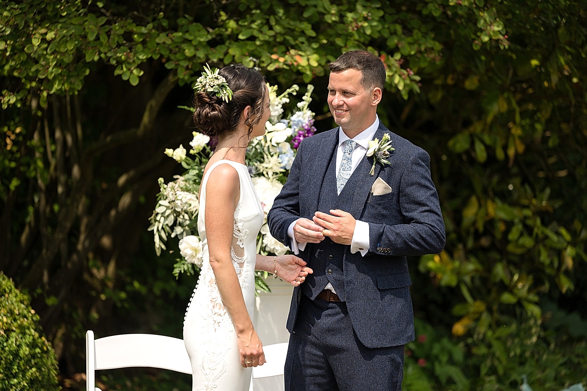 Groom fiddling with his wedding ring after the bride has put it on his finger