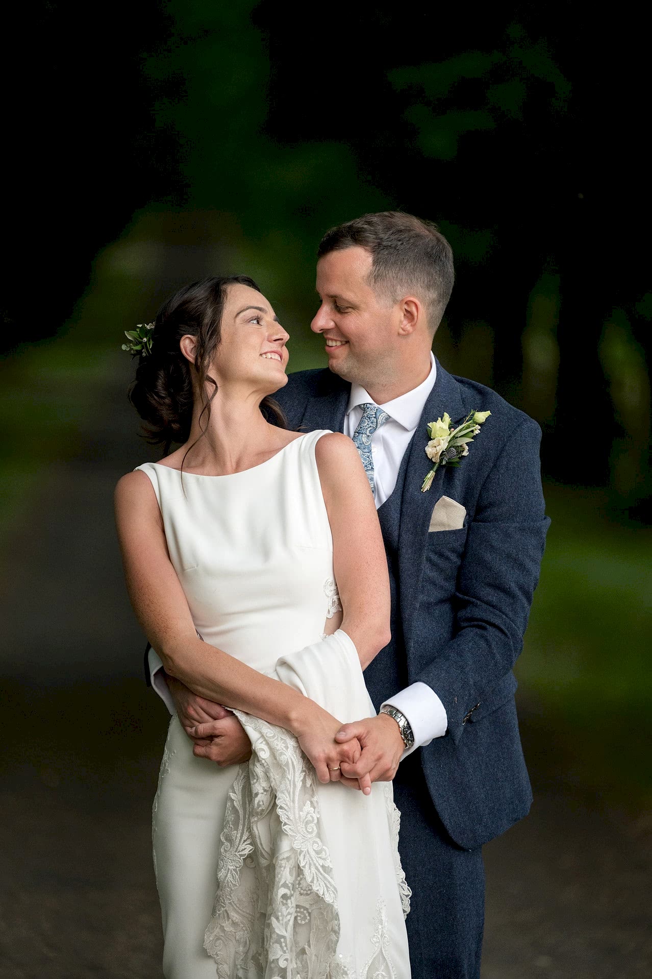 The bride and groom practicing their first dance on the tree-lined avenue at Notley Abbey