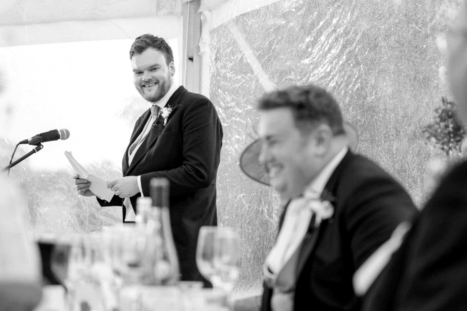 Best Man laughing as he makes a joke during his speech