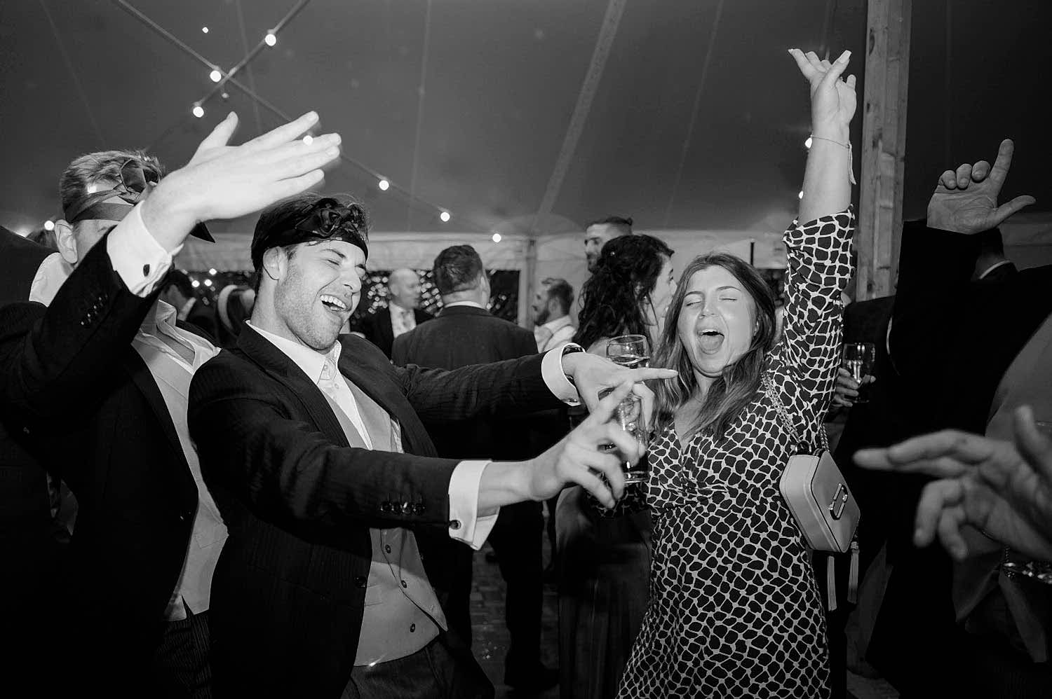Wedding guests dancing wildly
